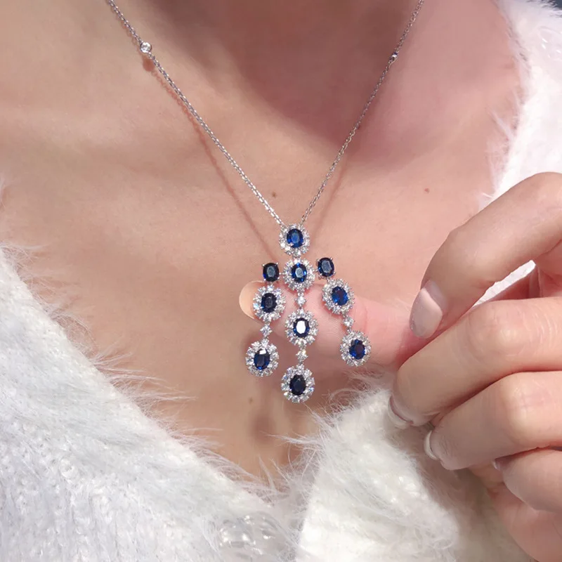 Женский ювелирный комплект из колье и серёг с синим фианитом