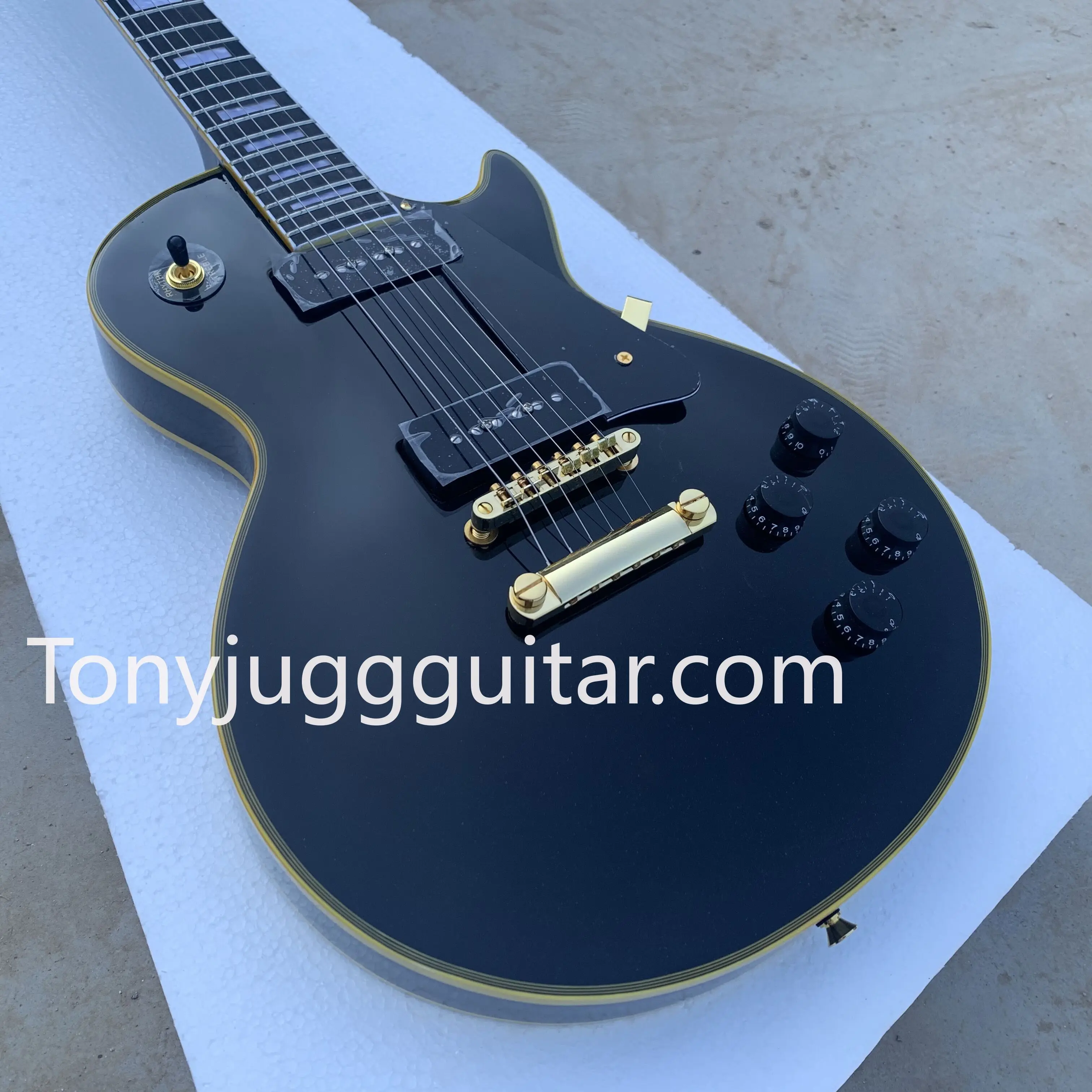 

Reissue Black P90 Pickup Black Electric Guitar Ebony Fingerboard, Yellow 5 Ply Binding, Black Pickguard,White Pearl Block Inlay