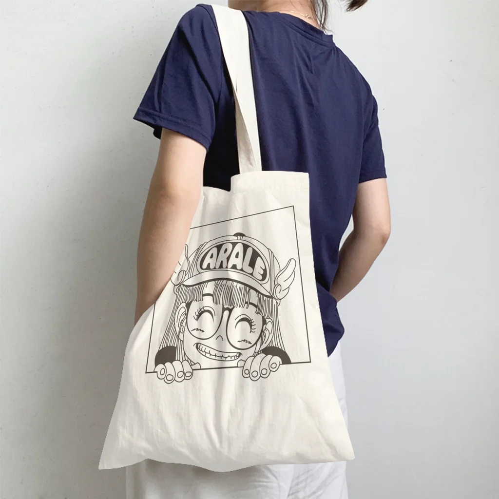 

Arale is LoveHandbag Dr Slump Japanese Manga Shoulder Canvas Bag Men Women Pocket Fitness Shopper HandBags Kawaii Pouch Tote Bag