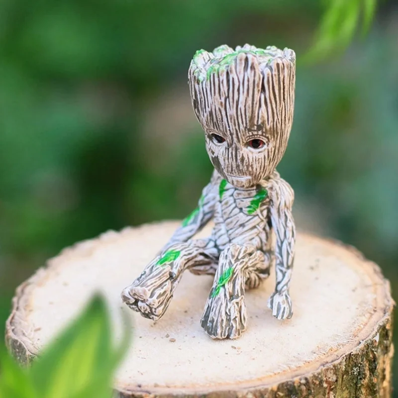 Купи Disney Marvel Avengers Groot Mini Figure Pen Holder Flower Pot Anime Toys Action Figure Sitting Groot Christmas Kids Toys Gifts. за 133 рублей в магазине AliExpress