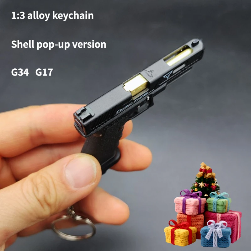 Фото Alloy Empire 1:3 G34 G17 Брелок из сплава, модель пистолета, всплывающая версия, съемная декомпрессионная игрушка, военная коллекция фанатов №1