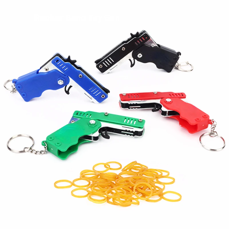 

Металлический Мини-пистолет можно сложить в виде кольца для ключей. Изысканная Подарочная игрушка для детей. Шесть вспышек резинового игрушечного пистолета.