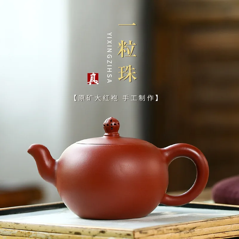 

Yixing teapot ore Dahongpao hollowed out a bead Kung Fu tea set famous pure handmade teapot.