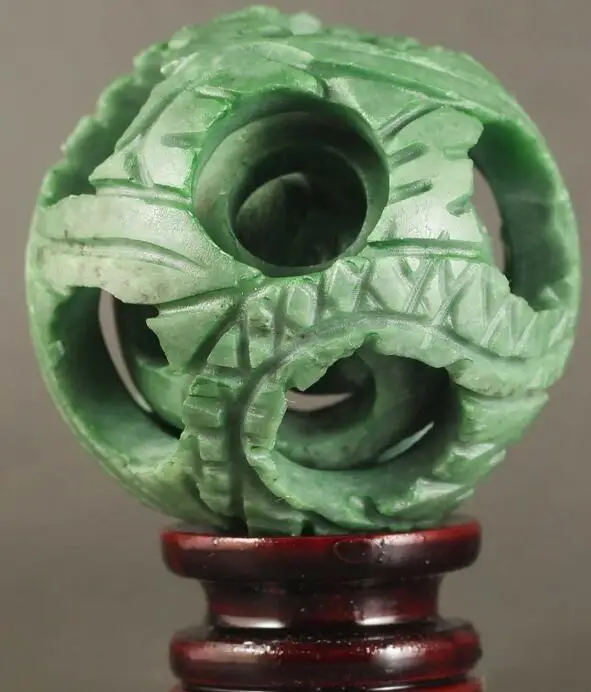 

Chinese Natural Jade Hand-Carved Jade Ball Hollowed Out Puzzling Ball Statue