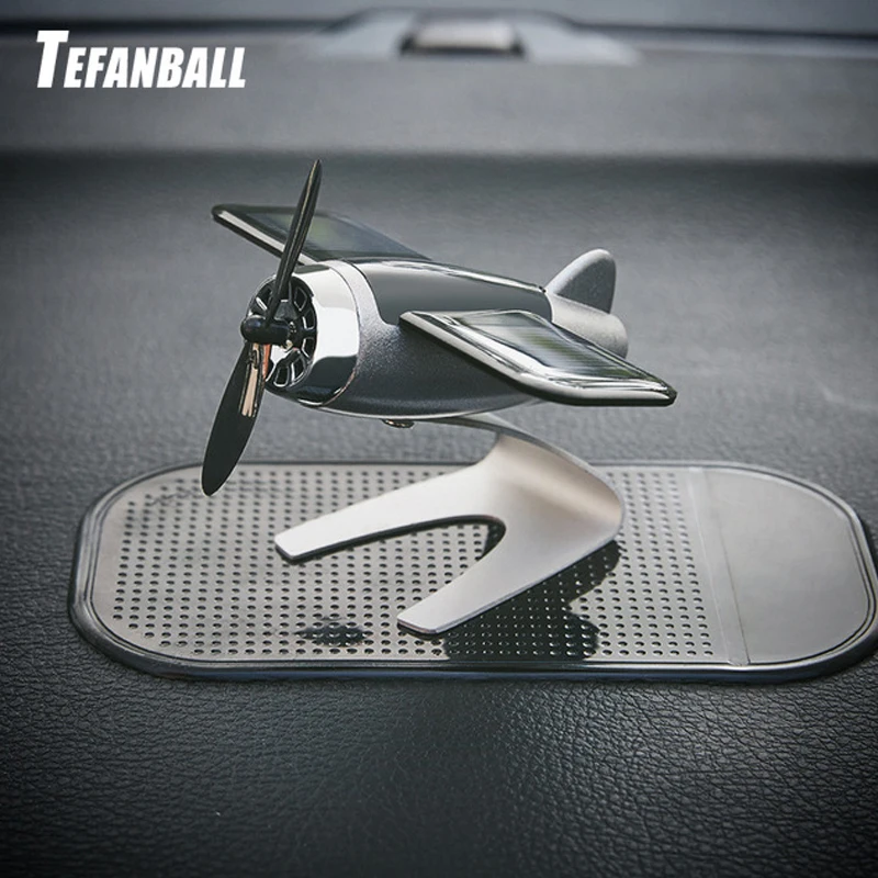 

Car Decoration Aromatherapy airplane decoration Non-slip mat alloy Solar energy Rotate aircraft dashboard solid Car styling