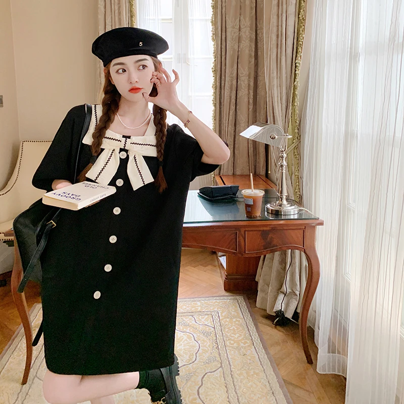 Женское платье в стиле ретро средней длины с бантом и рукавами-фонариками