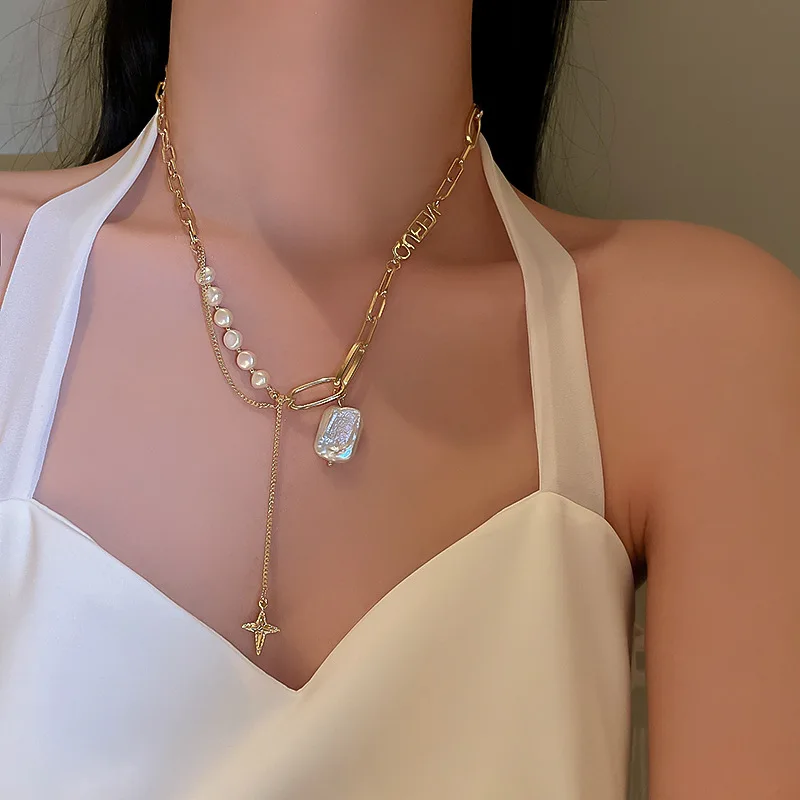 

Korean version of fashion personality freshwater pearl four Mang star necklace female temperament exquisite clavicle chain