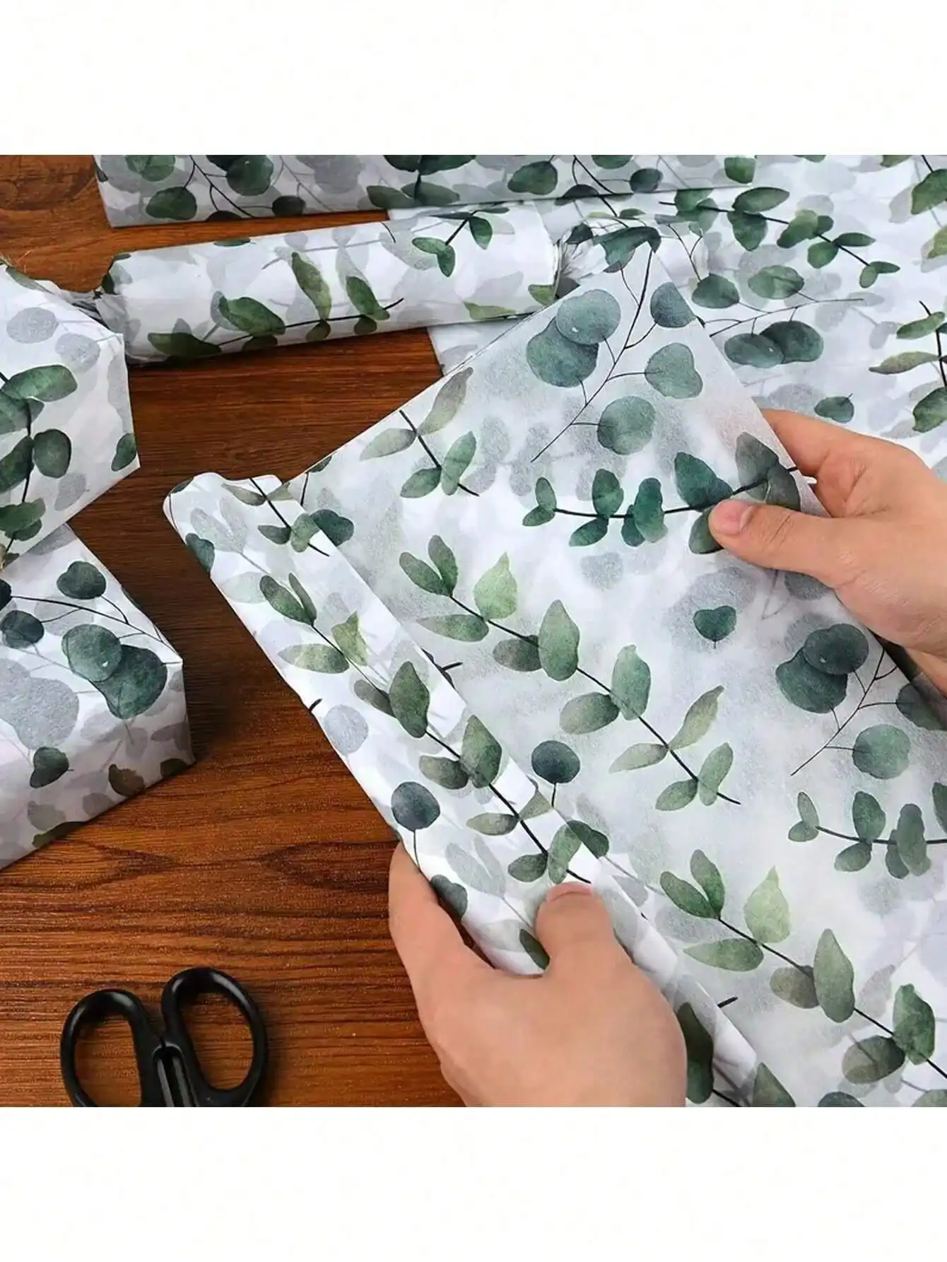 

Бумага для упаковки с зелеными листьями