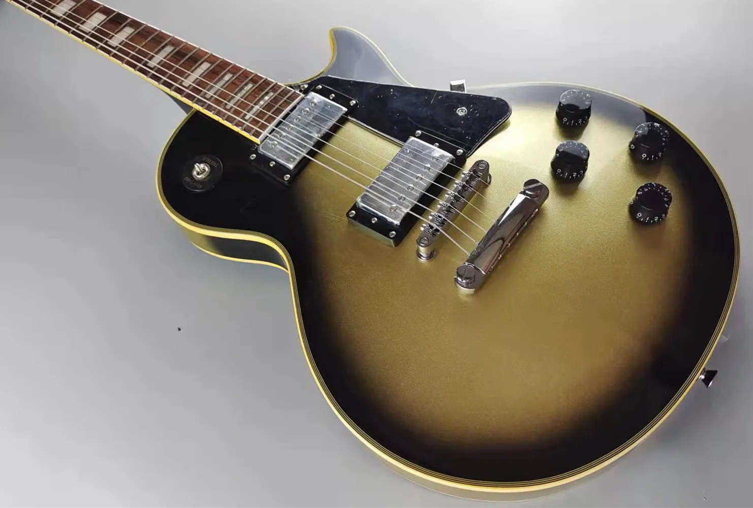 

Customized Electric guitar, yellow logo and body binding, retro gold paint finish, quick mail package