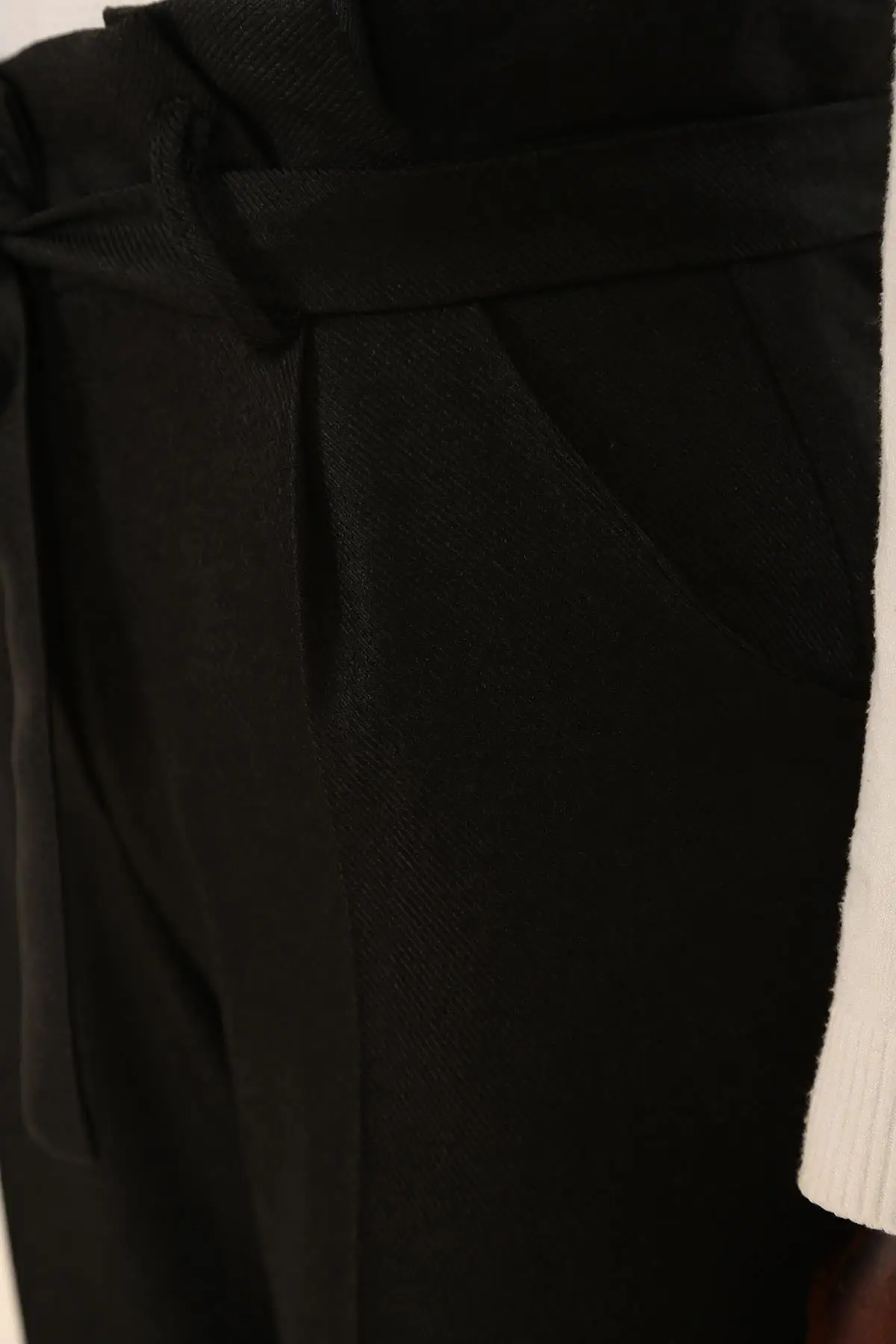 

Woman with Black Pleated Arched Handle Narrow Leg Pants Women's Islamic Clothing Pants