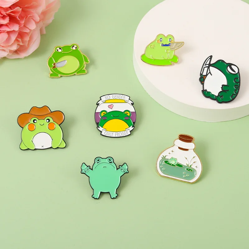 

Cartoon Dagger Frog Enamel Pins Custom Bottle Pond Genderless Animal Brooches Shirt Lapel Badge Cute Fashion Jewelry Gifts