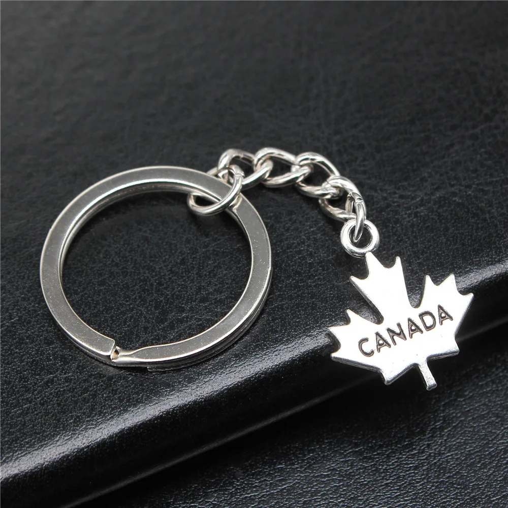 Сувениры подарок мужской брелок 2 цвета 22x18 мм с подвеской в виде канадского