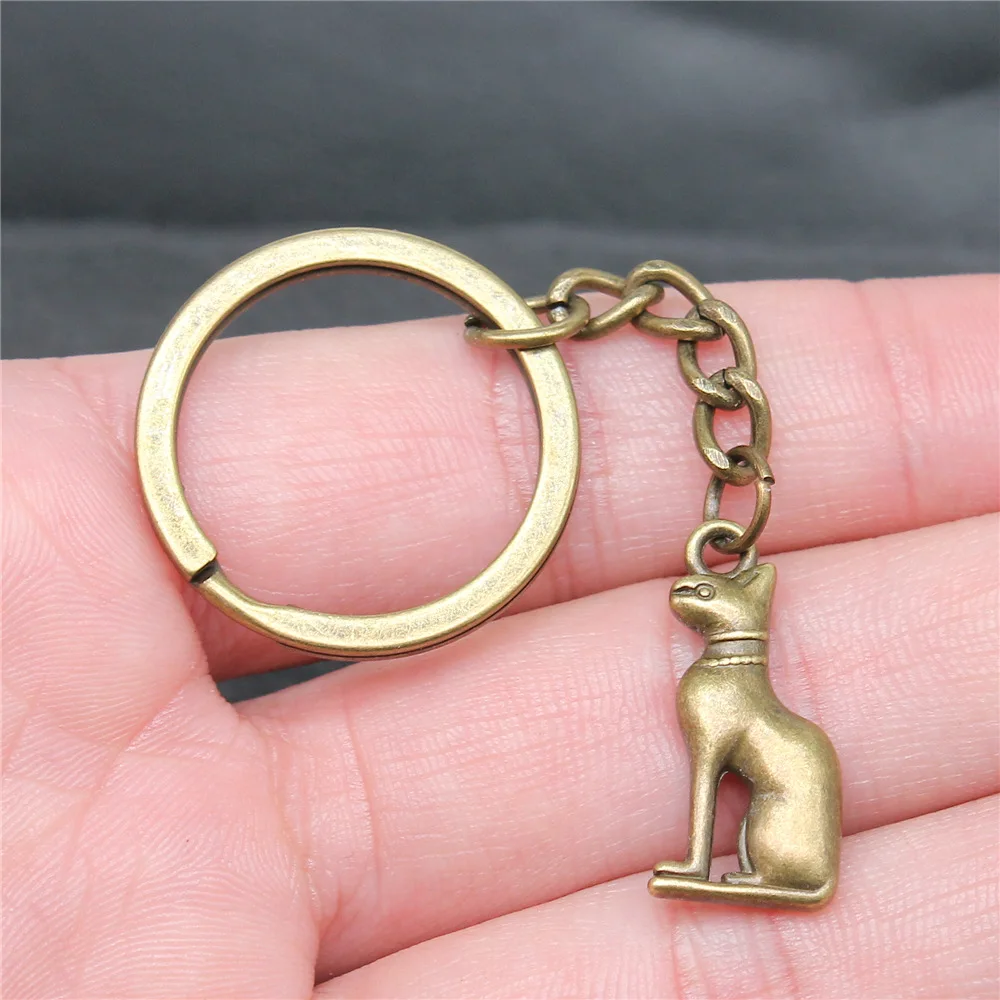 Сувениры подарок мужской брелок 2 цвета 25x12 мм с подвеской в виде египетского кота