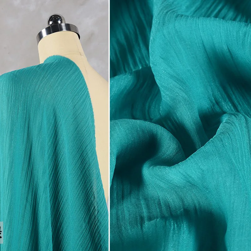 

Peacock green nylon polyester flash crepe breathable bright silk elegant crimped texture fabric dress Han suit design fabric