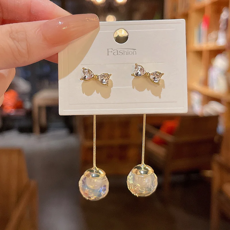 

New light luxury long fringed dream crystal earrings for women with delicate diamond-set bow stud earrings
