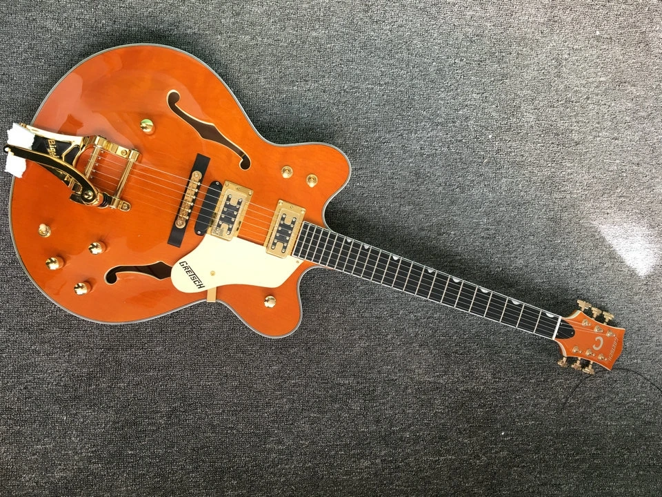 

free delivery! Wholesale high quality jazz electric guitar orange jazz guitar, ebony fingerboard. Can be customized