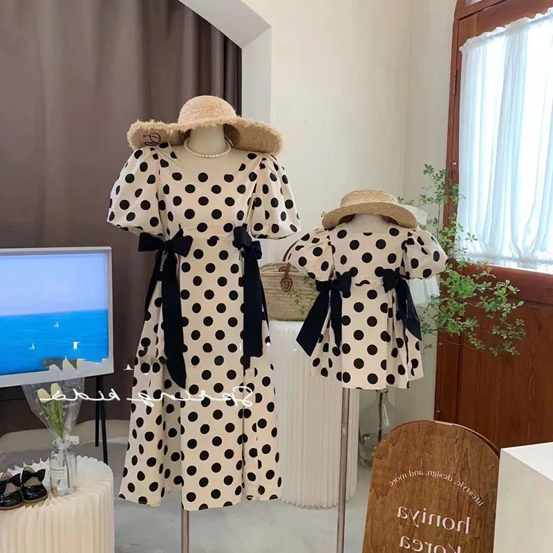 

Korean children's clothes parent-child clothes girls wave dot cotton skirt bow knot mother daughter fashion square neck dress