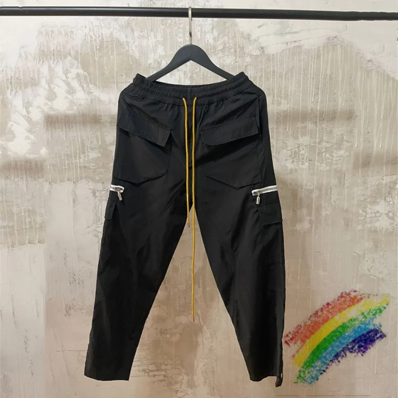 

Black RHUDE Overalls Men Women Zipper Pocket RHUDE Cargo Pants Buttoned Hem Retro Multi Pockets Trousers