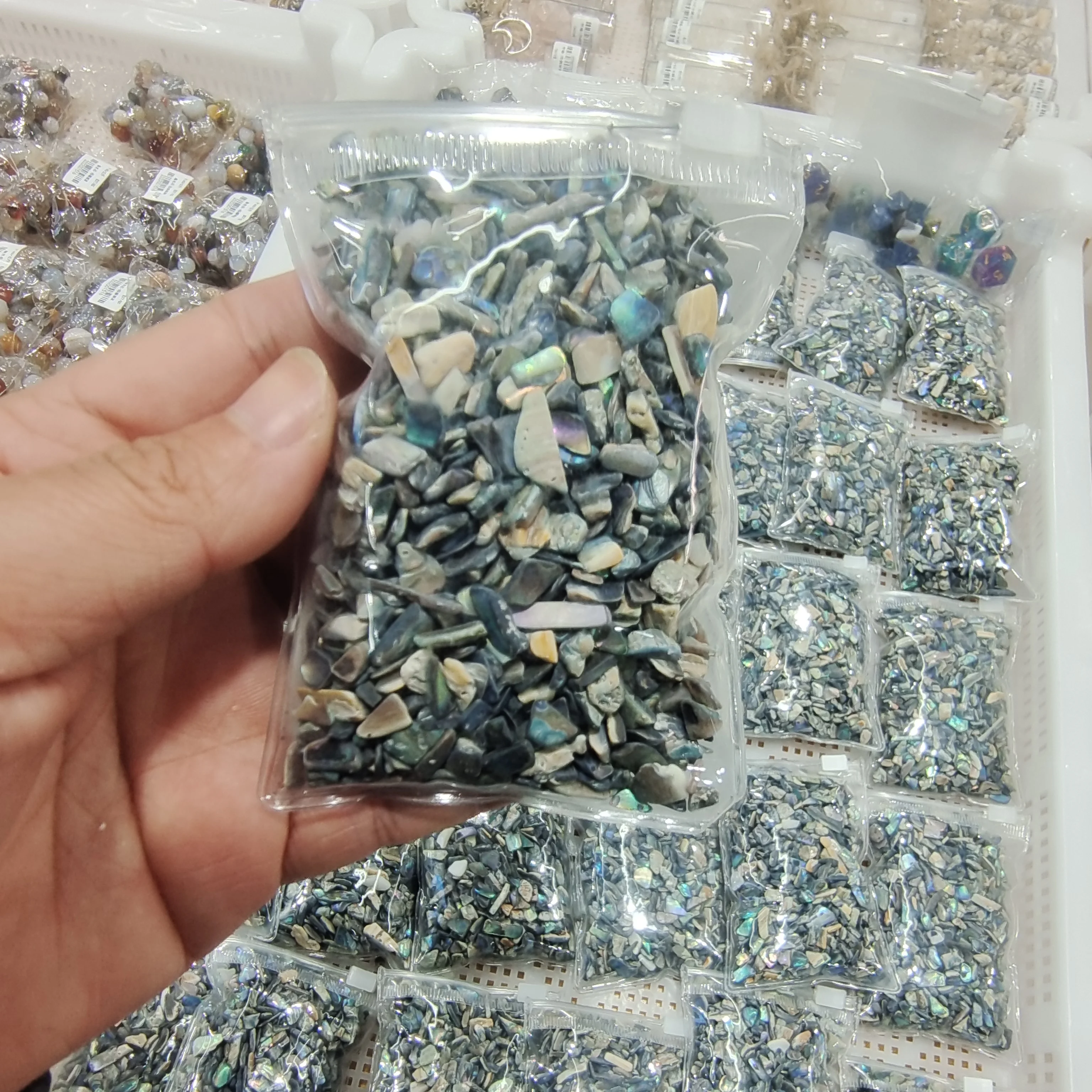 

a packet of Natural Crushed Abalone Shell Mother of Pearl shell for DIY Jewelry Mother Pearl Scraps for fake nails wholesale