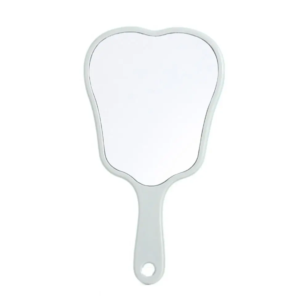 

Портативное зеркало в форме зуба