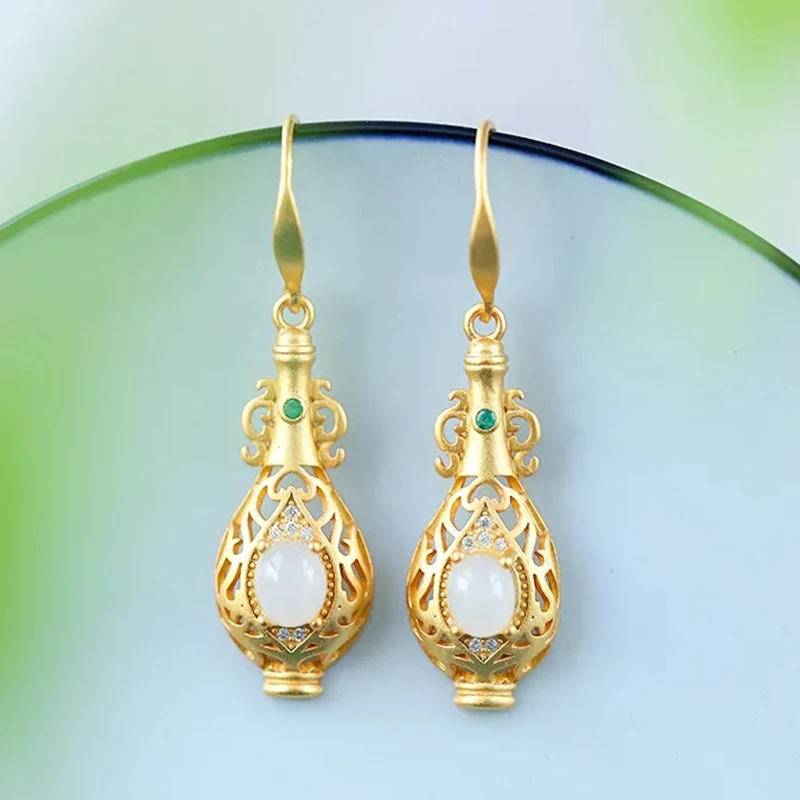 

Natural Hetian white jade vase-shaped long ear hooks Chinese retro palace style unique gold craft female silver jewelry