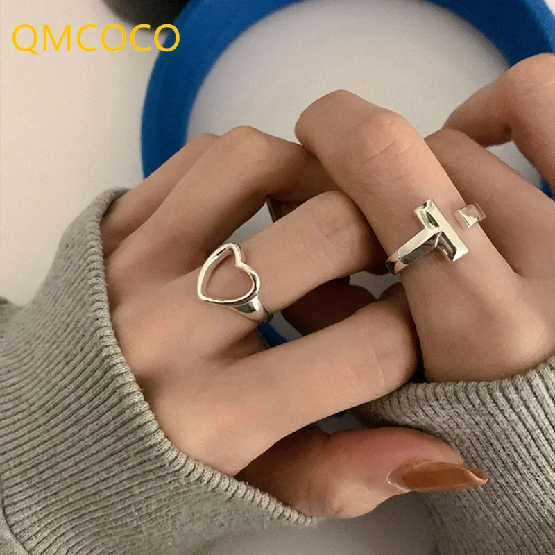 

QMCOCO New Style Hollow Out Heart Silver Color Finger T Shape Rings For Women Girl Fashion Punk Trendy Adjustable Jewelry Gifts