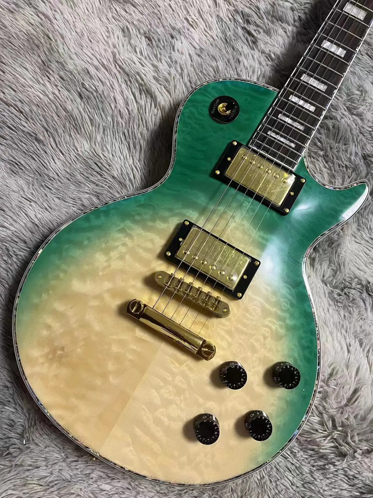 

Green Quilted maple top 22 frets Electric Guitar Imported Gold Hardware