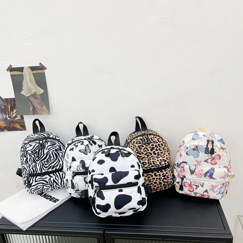 Купи Fashion nylon women's bag animal print small backpack teen girl schoolbag soft girl cute funny cow spot Backpack mini backpack за 221 рублей в магазине AliExpress