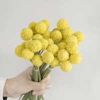 bride holding bouquet simulation hand tied gold ball living room coffee table decoration simulation yellow golden mallet flower