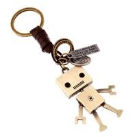 wangaiyao new couple simple cartoon cute robot cowhide keychain personality retro woven key pendant creative bag pendant