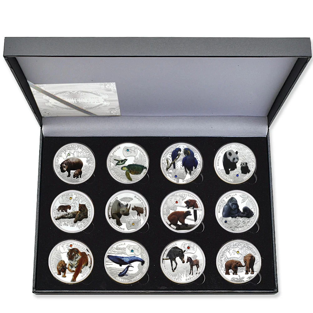 

Посеребренные монеты с животными 12 шт.