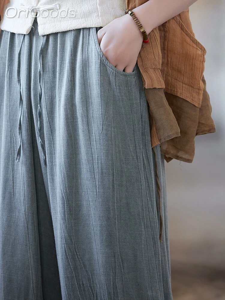 Женские широкие брюки из гладкой тонкой ткани с поясом на резинке