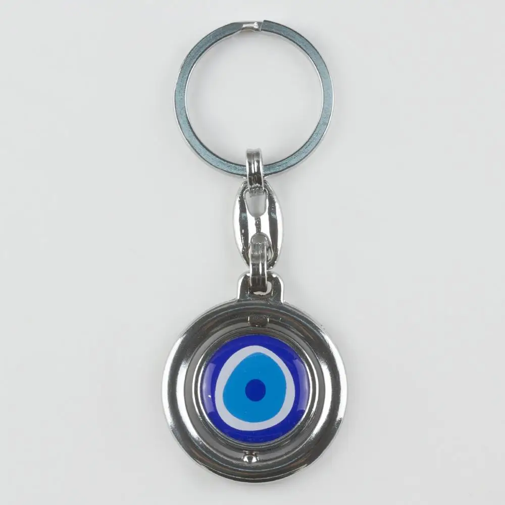 

Металлический брелок с изображением сглаза
