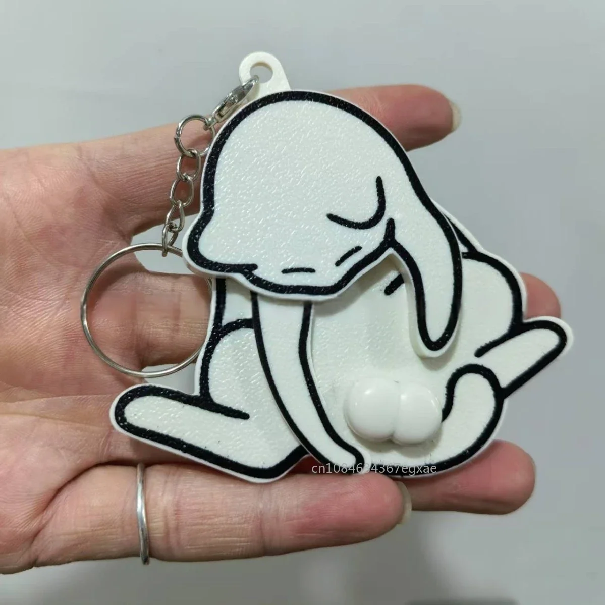 

Пластиковый брелок с шариками в виде кота