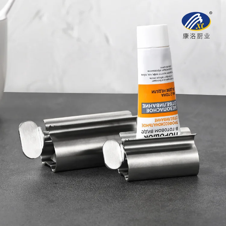 

Stainless steel toothpaste holder, toothpaste squeezing device