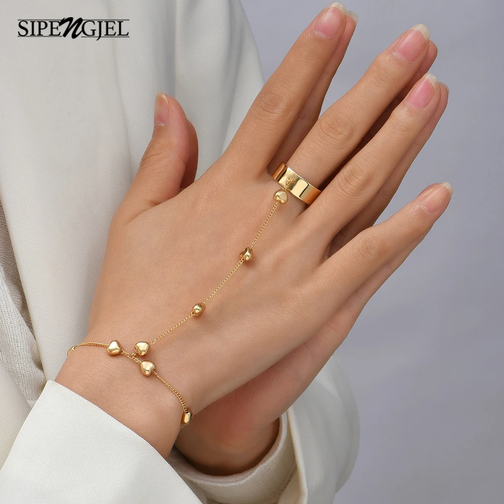 

SIPENGJEL Fashion Link Connected Gold Color Wide Finger Ring Bracelets Simple Heart Pendant Bracelet for Women Jewelry