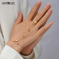 sipengjel fashion link connected gold color wide finger ring bracelets simple heart pendant bracelet for women jewelry