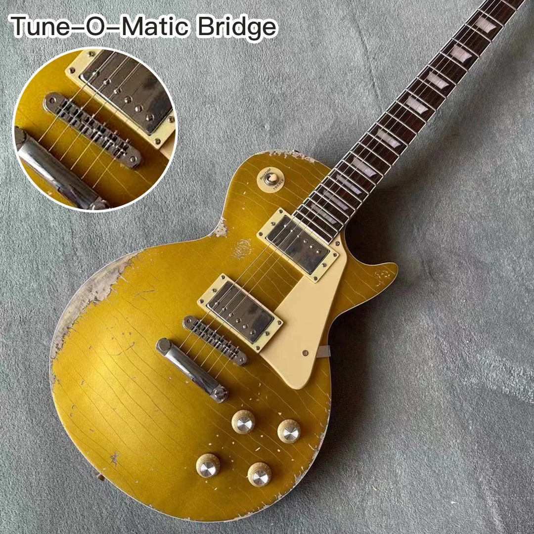

Стандартная электрогитара золотого цвета с мостовыми реликвами Tune-o-Matic от рук корпус из красного дерева