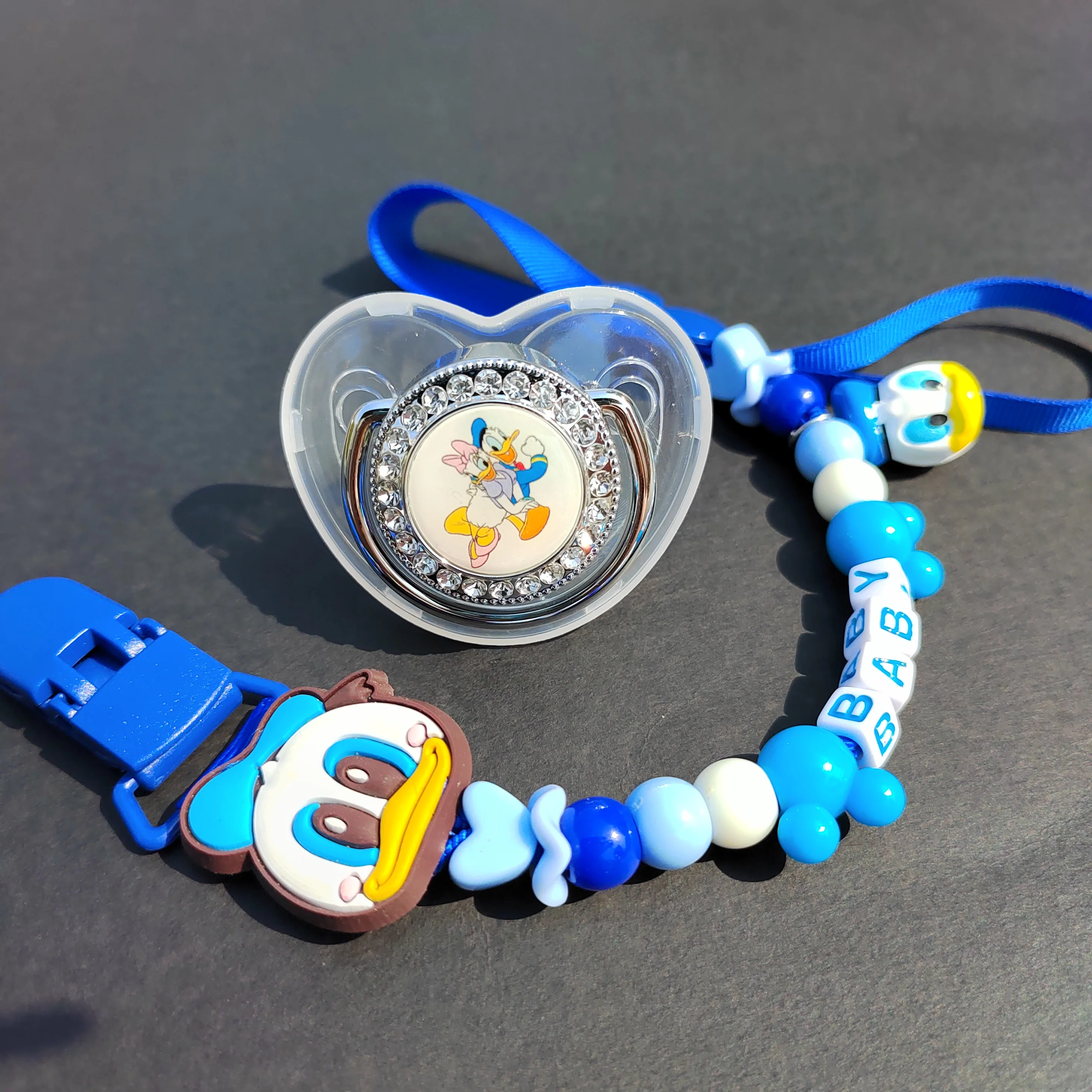 

Newborn Feeder Supplies Duck Tang Cartoon Necklace Pacifier Clip Holder Infant Character Image Soothing Baby Portable Chupeteors