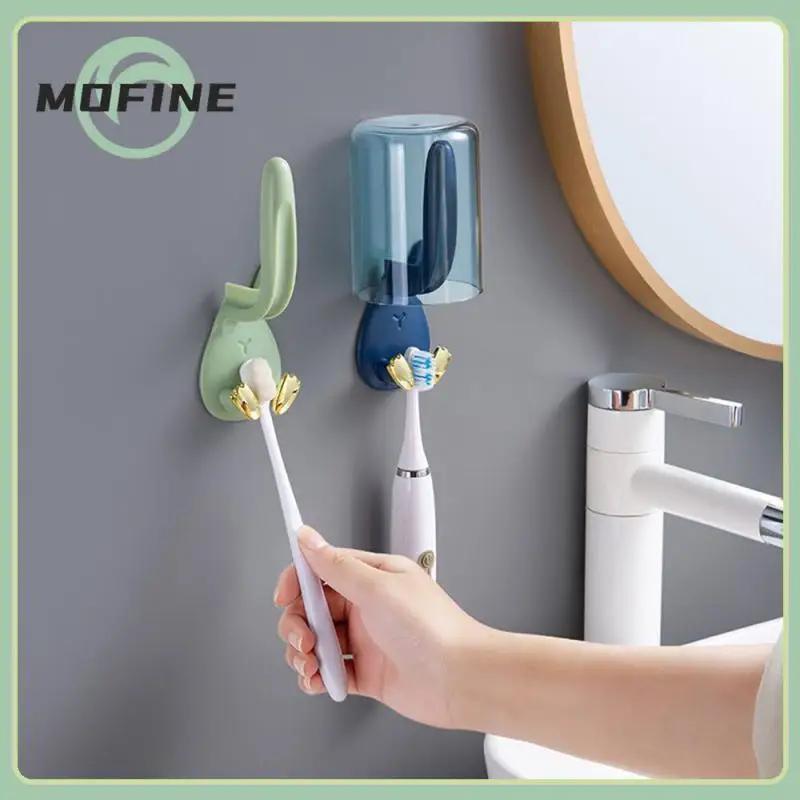 

Wall Mounted Mouthwash Cup Holder Stand Self-adhesive Hanging Tooth Brush Drying Rack Toothbrush Holder Perforation-free