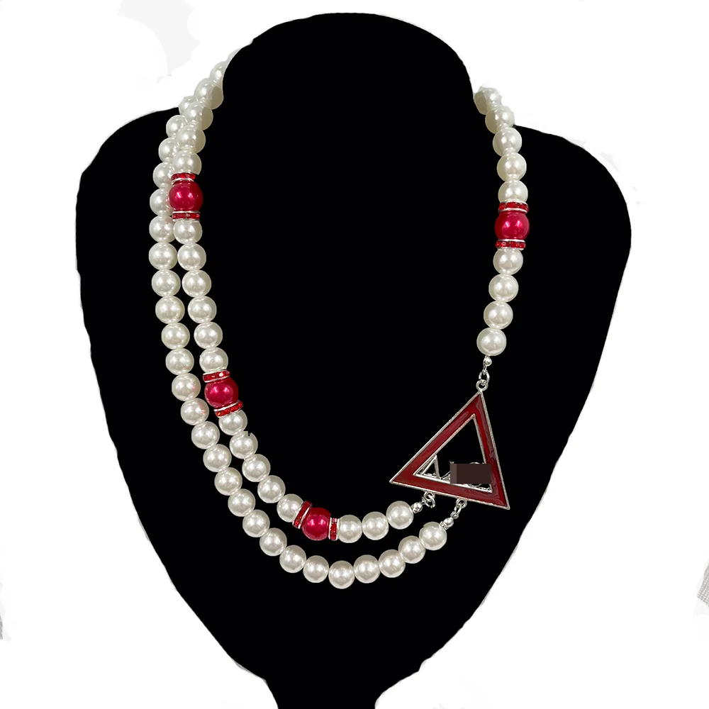 

Украшение-ожерелье с жемчугом, надпись DST