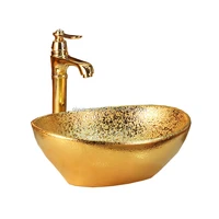 Hot selling ceramic bathroom sink for bathroom vanity oval design couner top gold washbasin