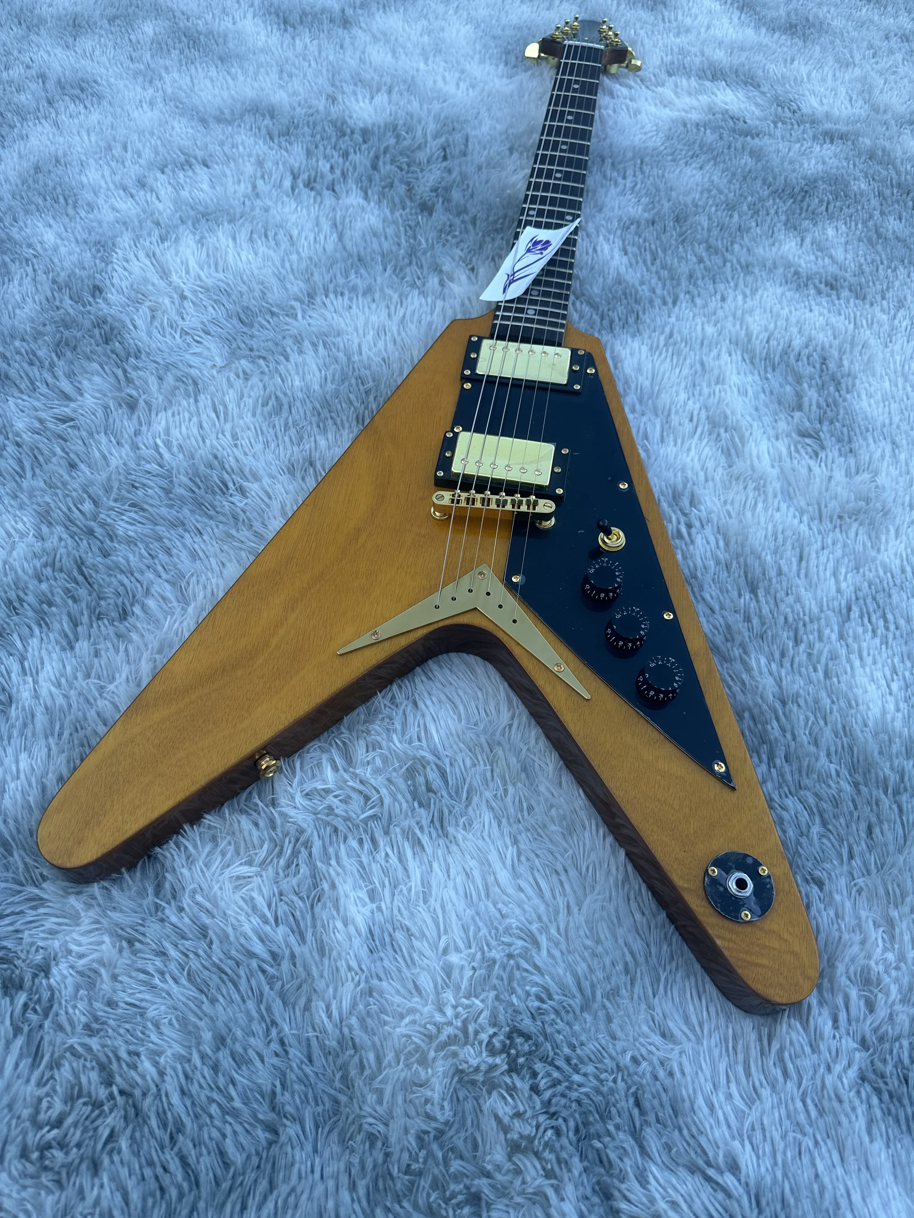 

Irregular electric guitar, log color flight V, gold accessories, in stock, imported good wood, lightning package