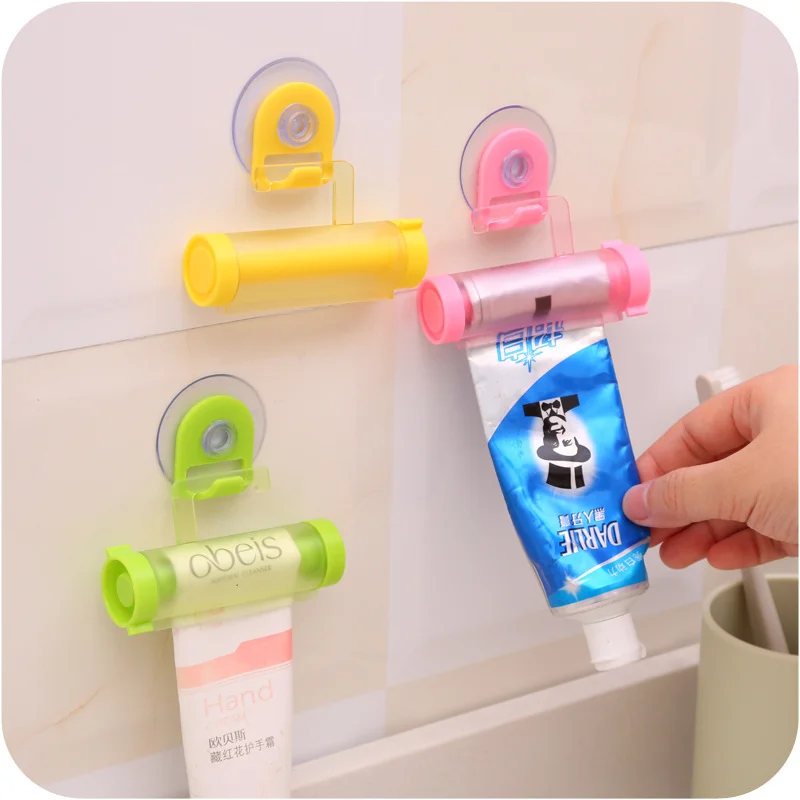 

New 1PCS Creative Rolling Squeezer Toothpaste Dispenser Tube Partner Sucker Hanging Holde Distributeur Dentifrice 5 Colors