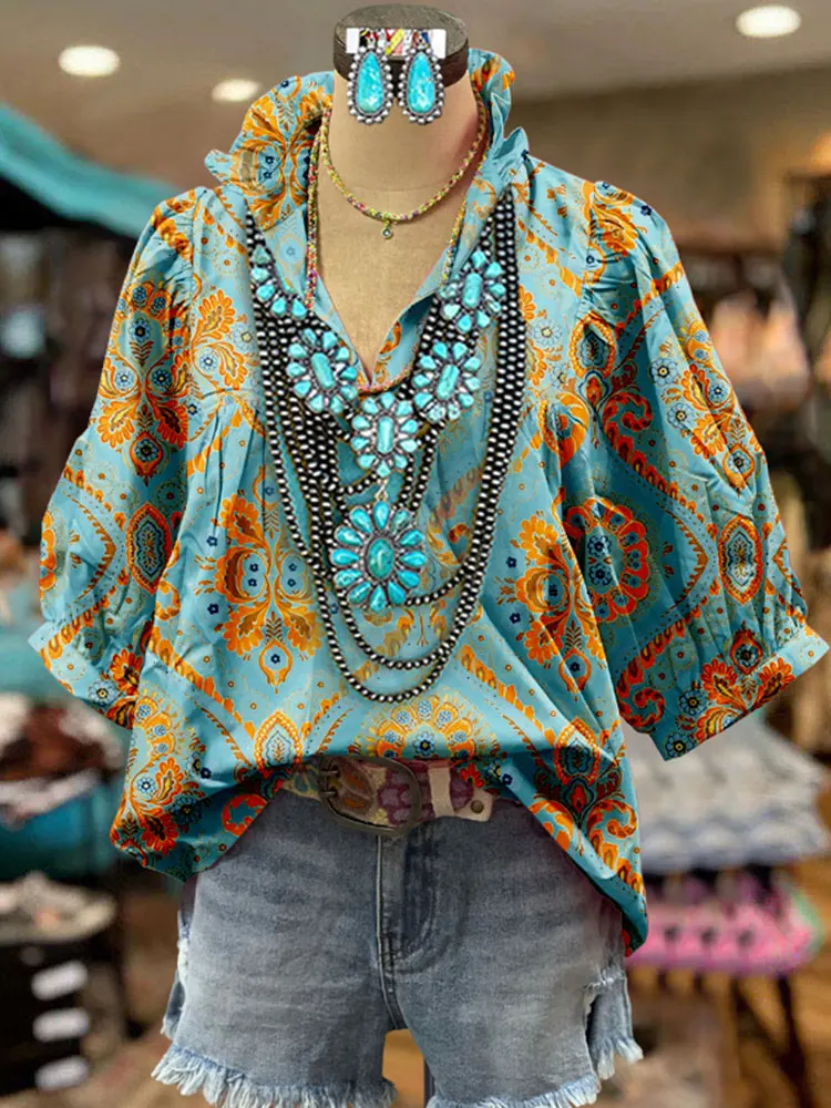 Женская блузка с цветочным принтом и пышными рукавами