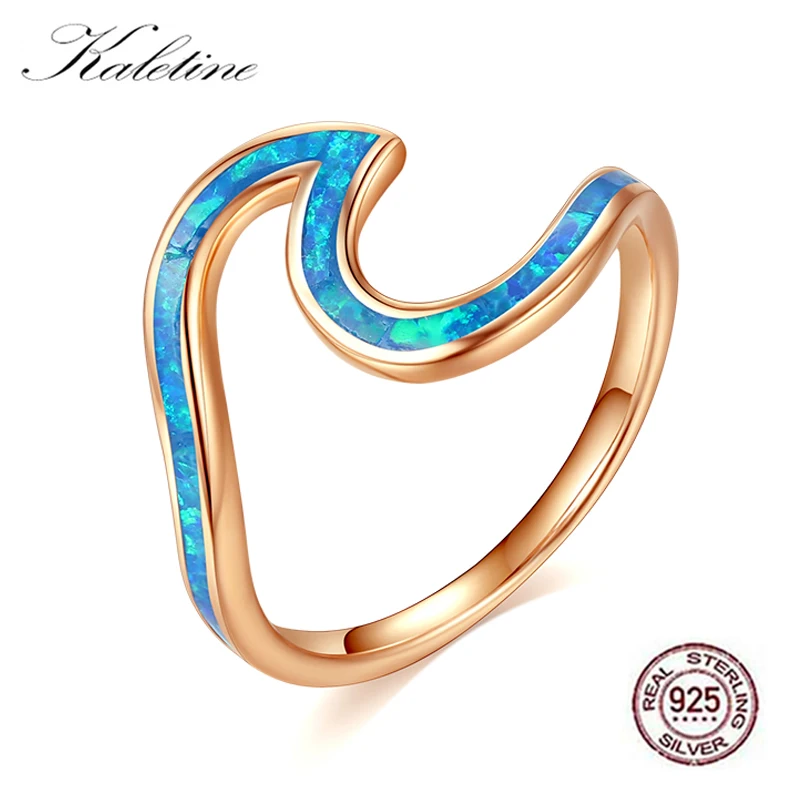 Кольцо женское из серебра 100% пробы с волнистым голубым огненным опалом