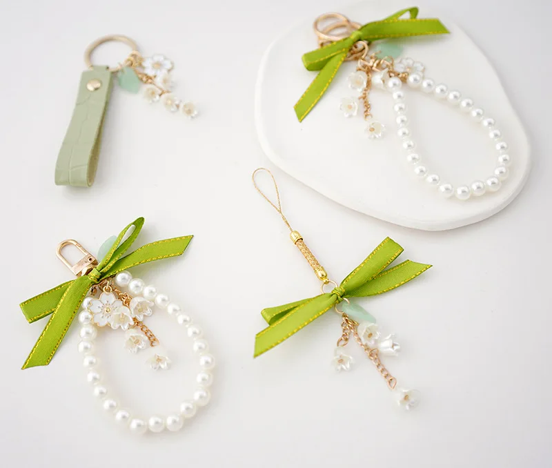 

Fashion Simple Green Ribbon Bow Pearl Hanging Key Chain Women Mobile Phone Bag Car Keychain Charm Decoration Wholesale