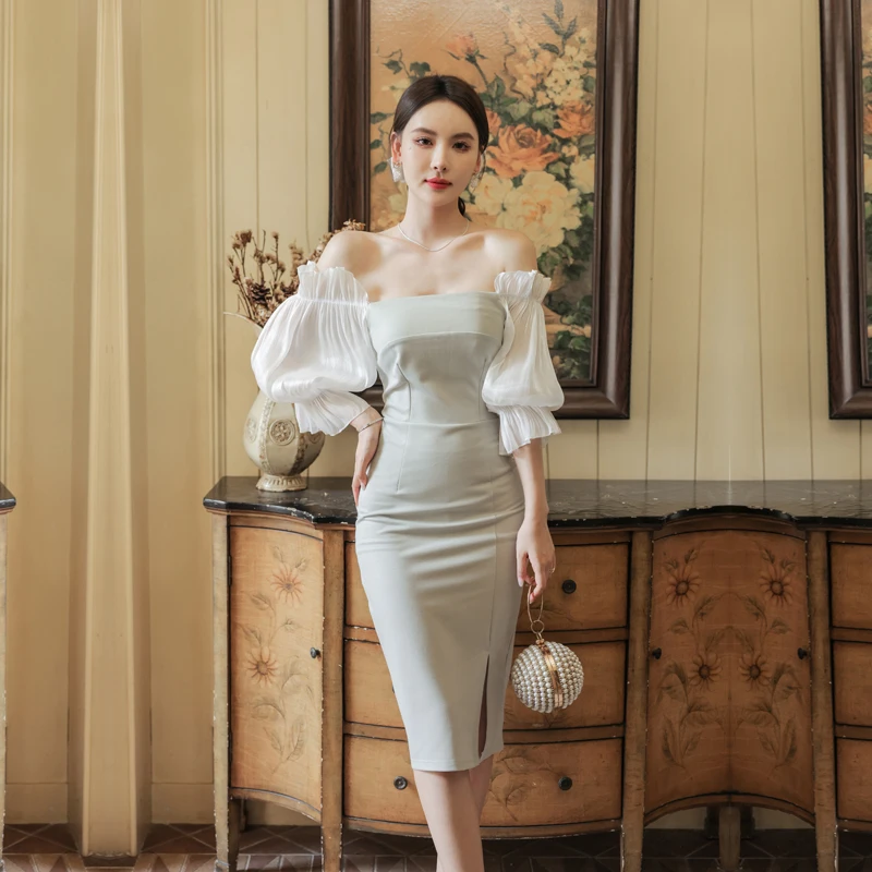 

Женское платье средней длины, с длинным рукавом и одним открытым плечом