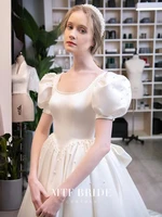 gorgeous satin wedding dress a line square collar puff sleeves pearl with bow sweep train princess backless lace up bridal gown
