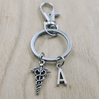 the caduceus keyring letter car key chain ring lobster clasp initial charm women jewelry accessories pendant round metal